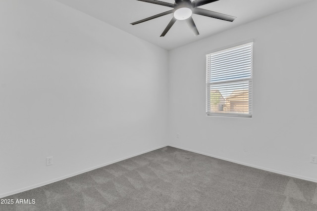 spare room featuring ceiling fan and light colored carpet