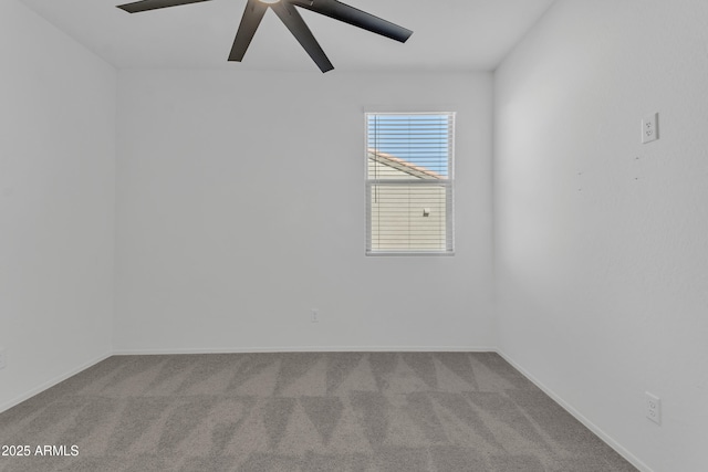 spare room with carpet and ceiling fan