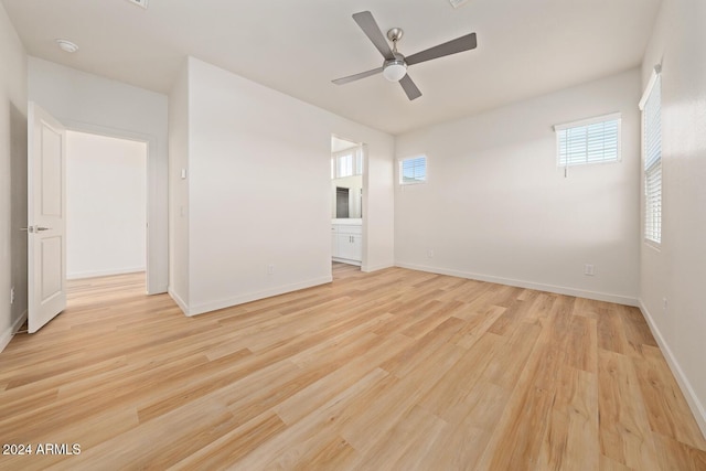 unfurnished room featuring ceiling fan and light wood-type flooring