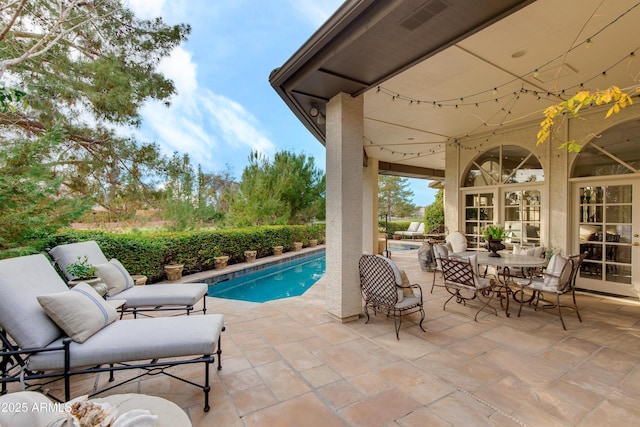 view of swimming pool featuring a patio