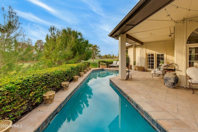 view of swimming pool featuring a patio area