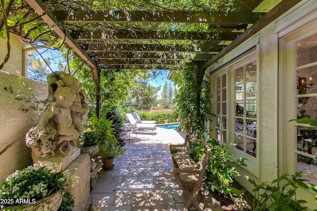 view of patio featuring a pergola