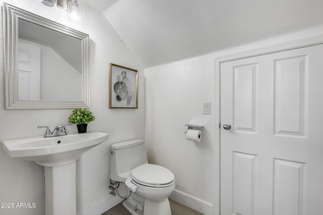 bathroom featuring sink and toilet