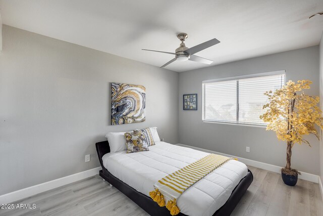 bedroom featuring ceiling fan and light wood-type flooring