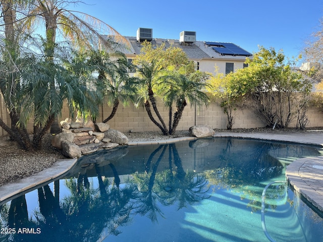 view of swimming pool with cooling unit