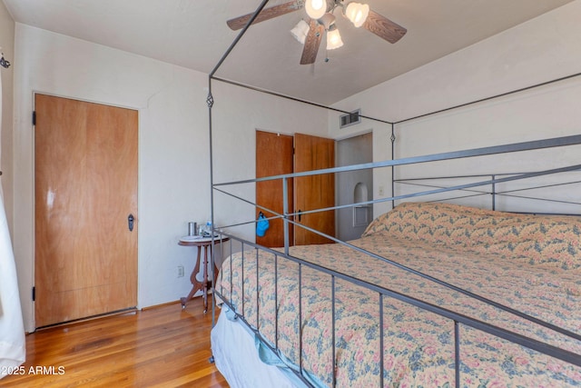 bedroom featuring ceiling fan and wood-type flooring