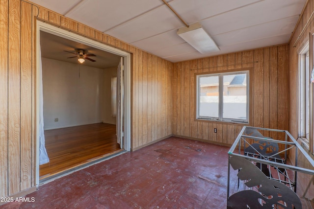 unfurnished bedroom with wooden walls