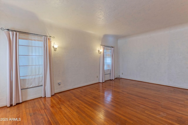 empty room with wood-type flooring