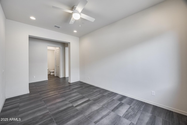 spare room featuring visible vents, recessed lighting, baseboards, and ceiling fan
