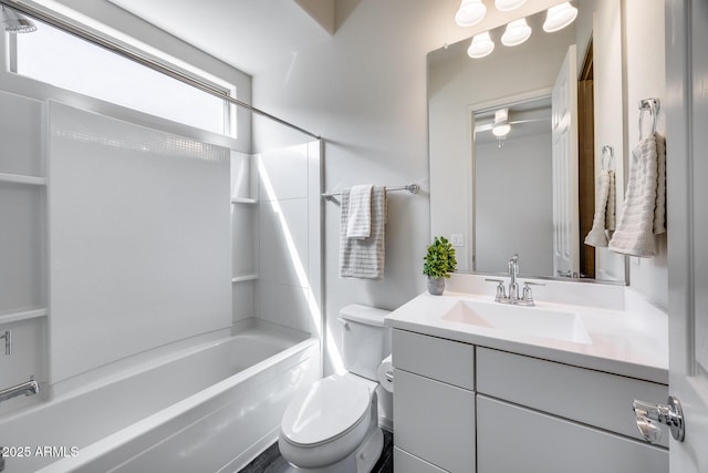 bathroom featuring vanity, toilet, and bathtub / shower combination