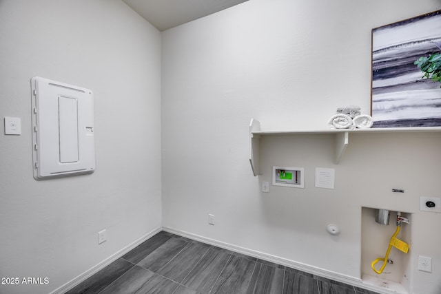 laundry room with baseboards, electric panel, laundry area, hookup for a washing machine, and hookup for a gas dryer