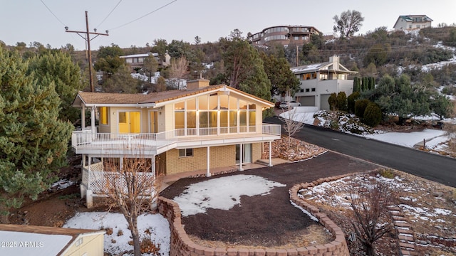 rear view of property with a balcony