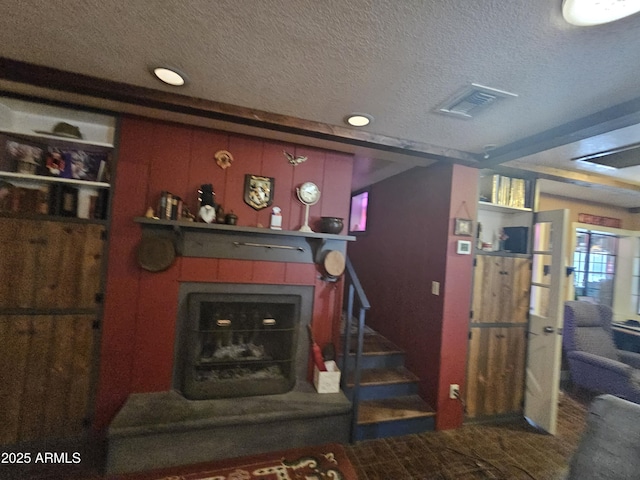 living room featuring a textured ceiling