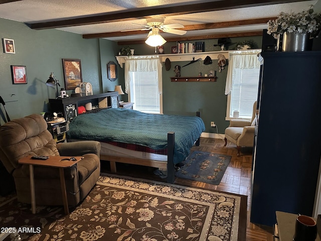 bedroom featuring ceiling fan, beamed ceiling, a textured ceiling, and parquet flooring