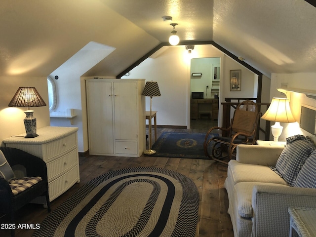 interior space featuring dark hardwood / wood-style floors and lofted ceiling