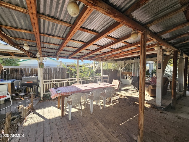 wooden deck with a grill