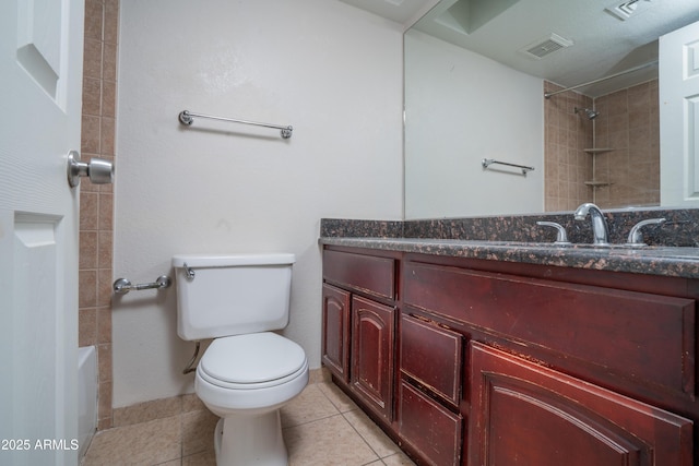 bathroom featuring toilet, tile patterned flooring, and vanity