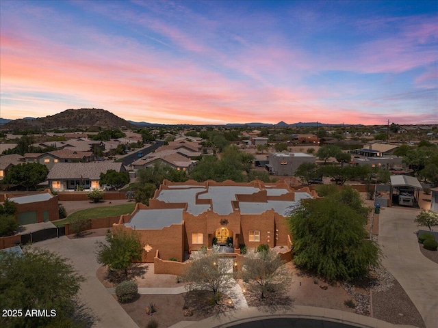 9435 E Hobart Cir, Mesa, AZ 85207 - aerial view at dusk of a residential view and a mountain view