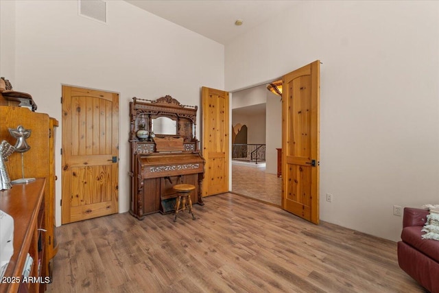 9435 E Hobart Cir, Mesa, AZ 85207 - office area featuring a towering ceiling and wood finished floors