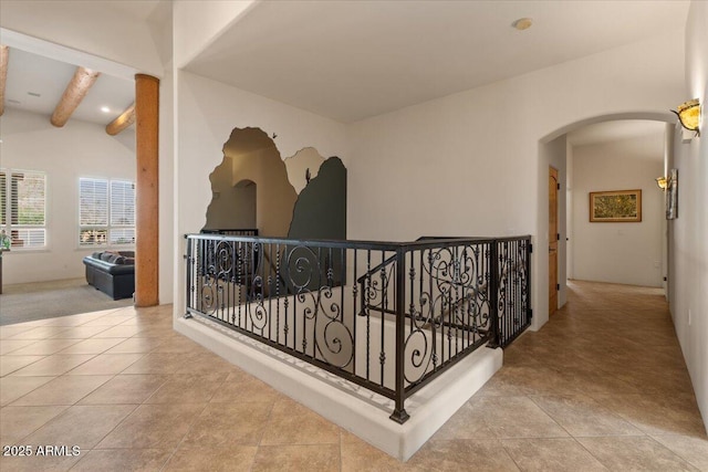 9435 E Hobart Cir, Mesa, AZ 85207 - hallway with arched walkways, an upstairs landing, and tile patterned floors