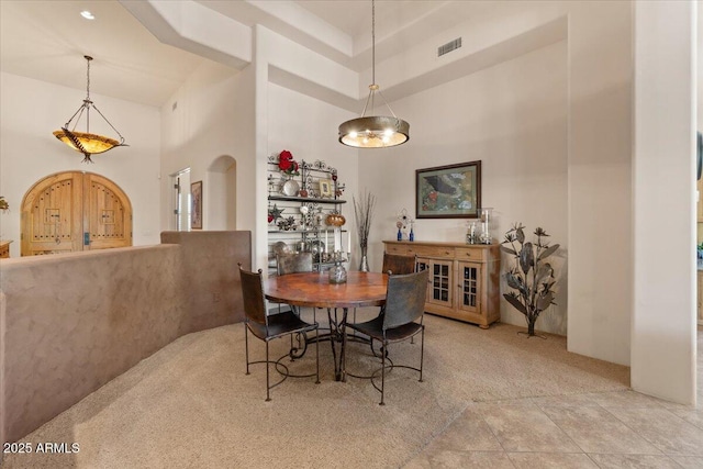 9435 E Hobart Cir, Mesa, AZ 85207 - dining space featuring carpet flooring and a towering ceiling