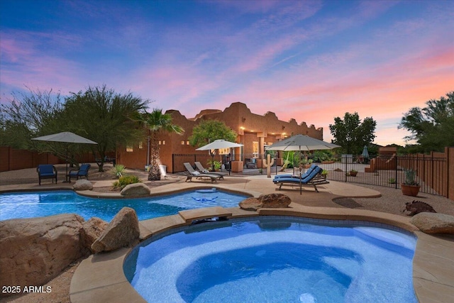 9435 E Hobart Cir, Mesa, AZ 85207 - view of swimming pool featuring a patio area, a fenced backyard, and a pool with connected hot tub