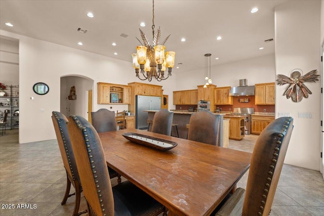 9435 E Hobart Cir, Mesa, AZ 85207 - dining room with arched walkways, a chandelier, and recessed lighting