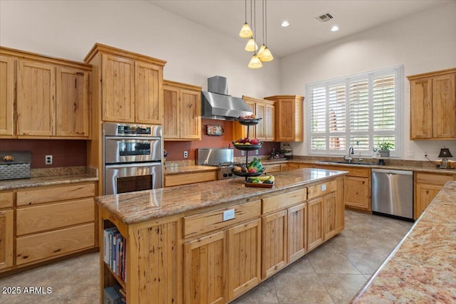 9435 E Hobart Cir, Mesa, AZ 85207 - kitchen with appliances with stainless steel finishes, range hood, a sink, a center island, and light tile patterned floors
