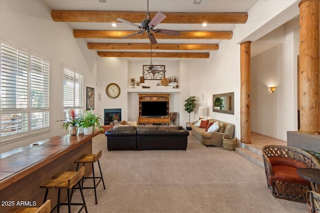 9435 E Hobart Cir, Mesa, AZ 85207 - living area with carpet flooring, a fireplace, beam ceiling, a ceiling fan, and recessed lighting