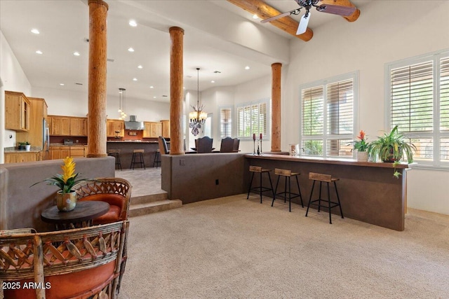 9435 E Hobart Cir, Mesa, AZ 85207 - living area featuring ornate columns, light carpet, ceiling fan, recessed lighting, and beam ceiling