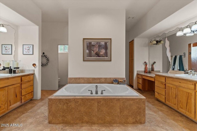 9435 E Hobart Cir, Mesa, AZ 85207 - full bathroom featuring a garden tub, two vanities, toilet, and tile patterned floors