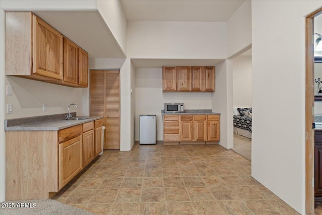 9435 E Hobart Cir, Mesa, AZ 85207 - kitchen featuring stainless steel microwave, a sink, and stone finish floors