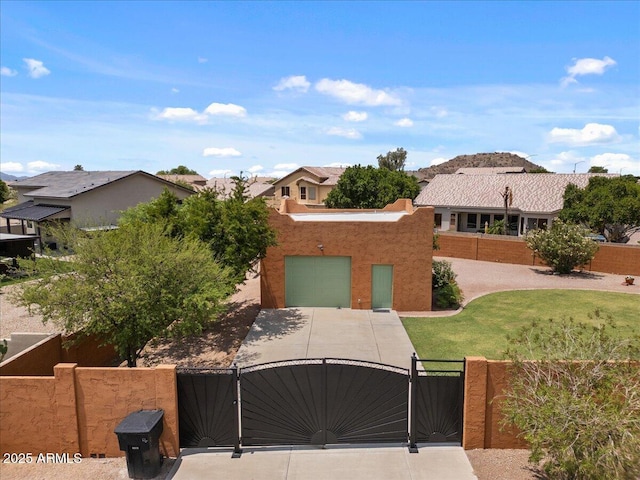 9435 E Hobart Cir, Mesa, AZ 85207 - view of front of property with a gate, driveway, an attached garage, and a residential view