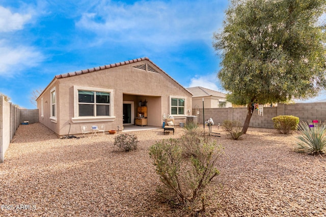 back of property featuring a patio