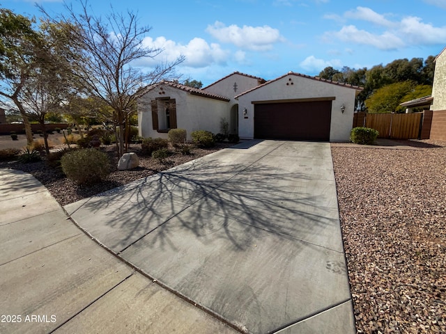 mediterranean / spanish-style house featuring a garage