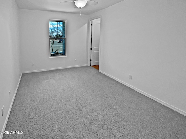 empty room with carpet floors and ceiling fan