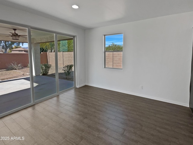 unfurnished room with hardwood / wood-style floors and ceiling fan