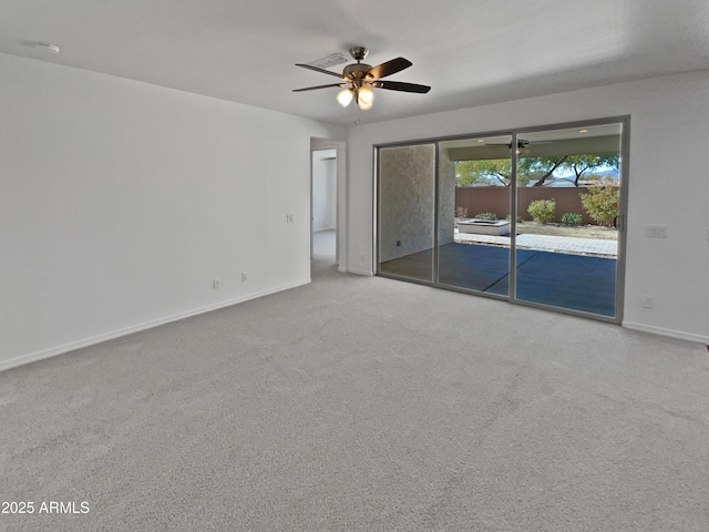 carpeted empty room featuring ceiling fan