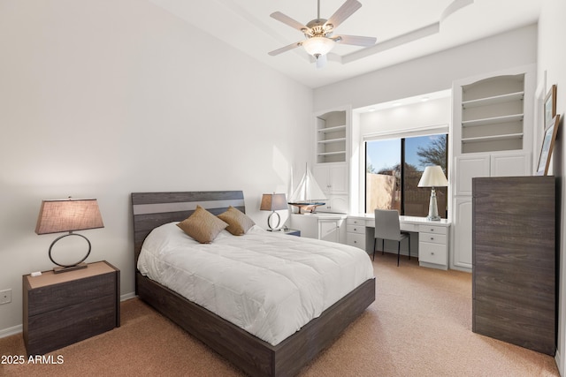 bedroom with light colored carpet, baseboards, and ceiling fan