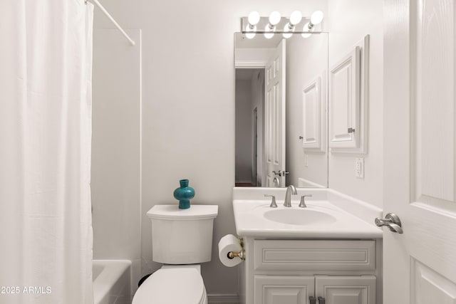 bathroom with toilet, vanity, and shower / tub combo