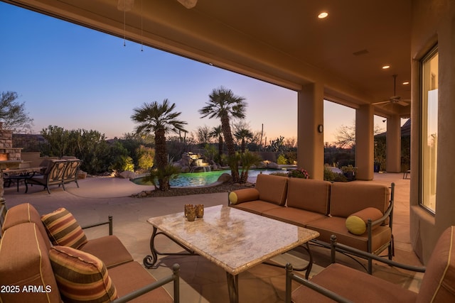 view of patio / terrace featuring outdoor dining space, outdoor lounge area, and a ceiling fan