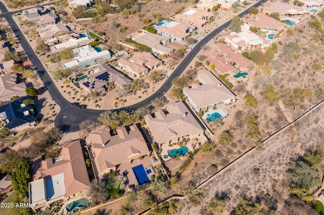 birds eye view of property with a residential view