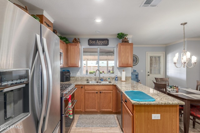 1925 W 12th Ave, Apache Junction, AZ 85120 - kitchen featuring stainless steel appliances, a peninsula, ornamental molding, light stone countertops, and a chandelier