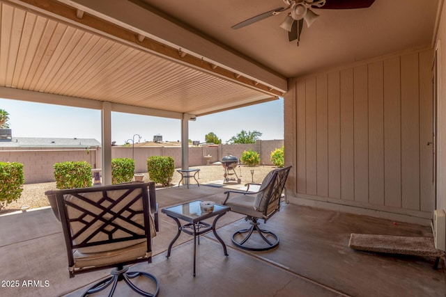 1925 W 12th Ave, Apache Junction, AZ 85120 - fenced backyard featuring ceiling fan, a patio area, and grilling area
