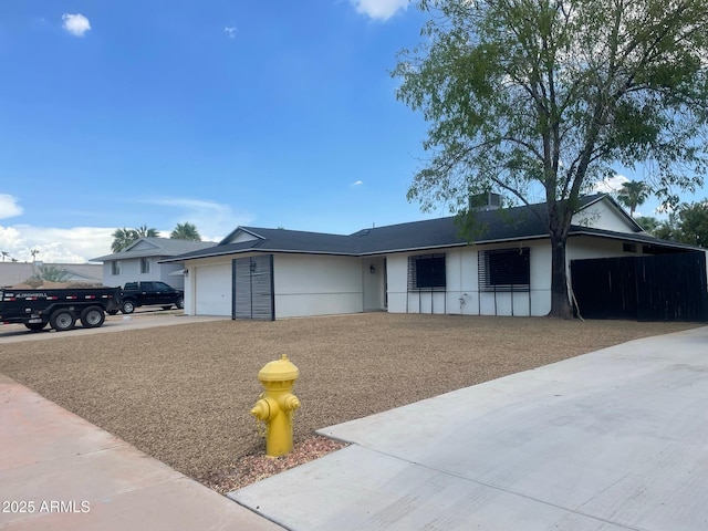 4415 S Poplar St, Tempe, AZ 85282 - ranch-style home featuring a garage, stucco siding, and driveway
