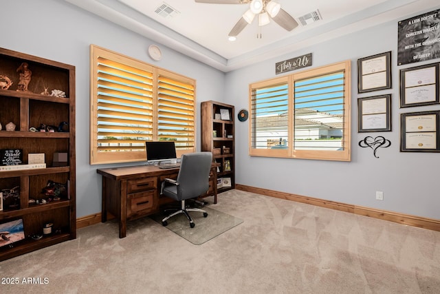 office area featuring visible vents, a ceiling fan, and carpet flooring