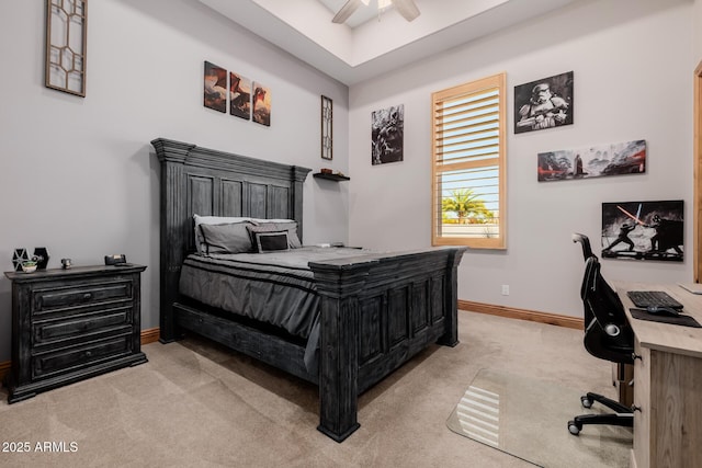 bedroom featuring light colored carpet, baseboards, and ceiling fan