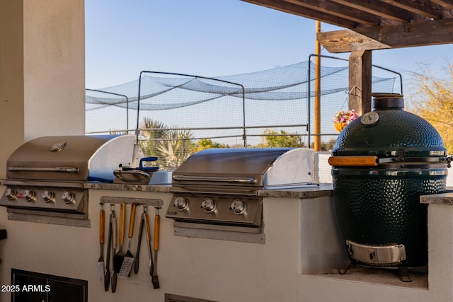 view of patio / terrace featuring grilling area and exterior kitchen