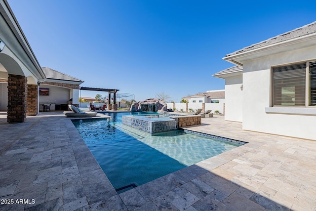 view of swimming pool with a patio, a pool with connected hot tub, and fence