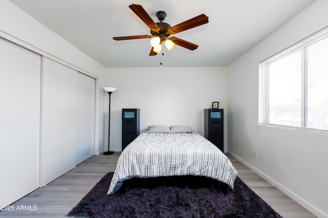 bedroom featuring ceiling fan and light hardwood / wood-style flooring